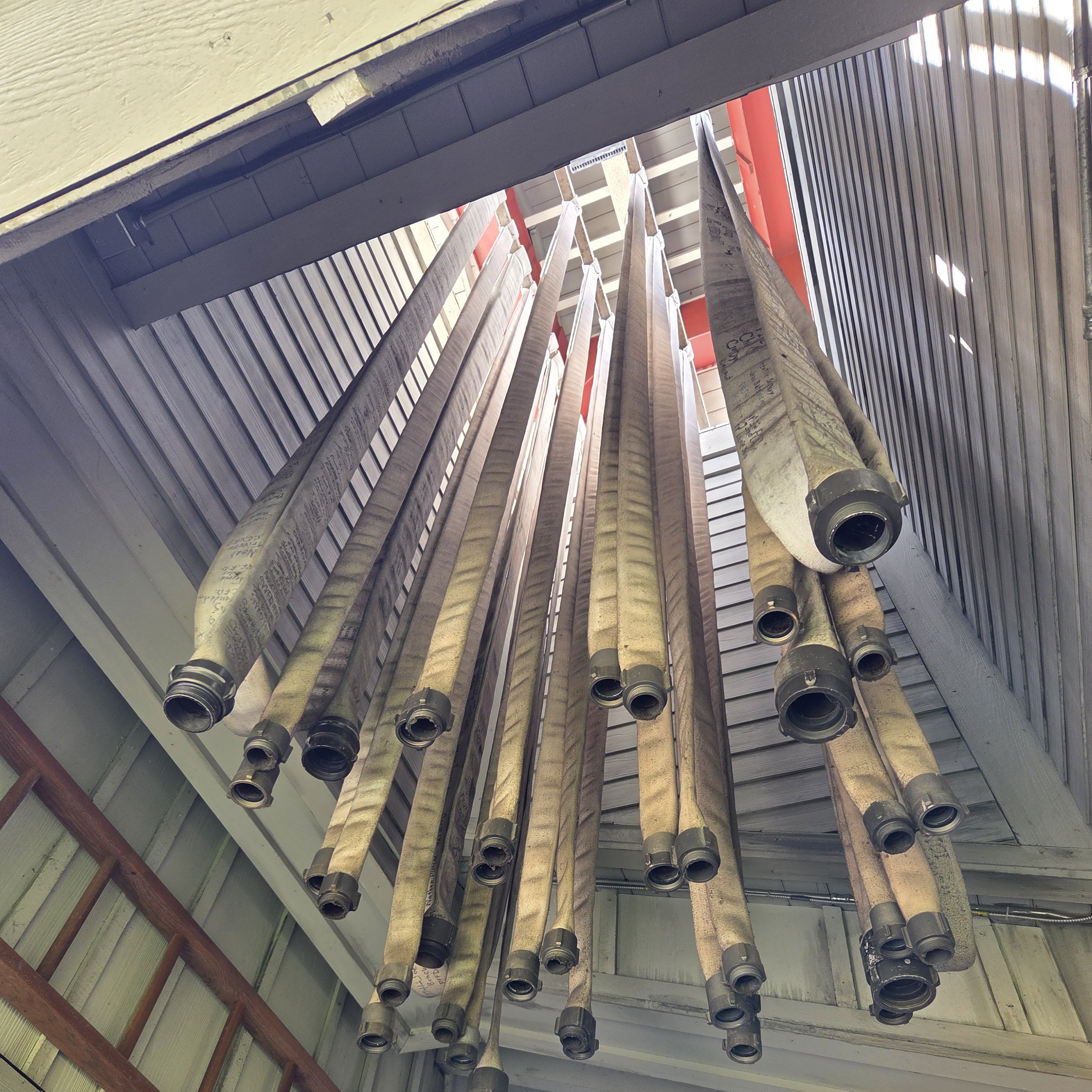 Firehoses hanging from the ceiling
